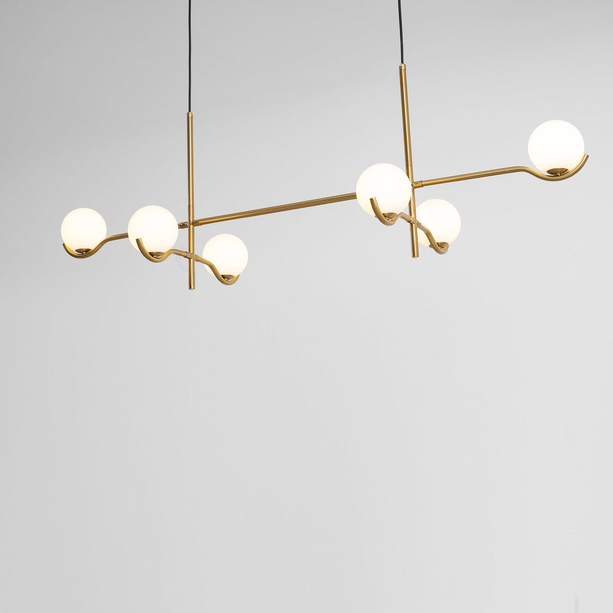 Multi Globe Pendant Light White Glass Shades on Slim Rods Dining Table