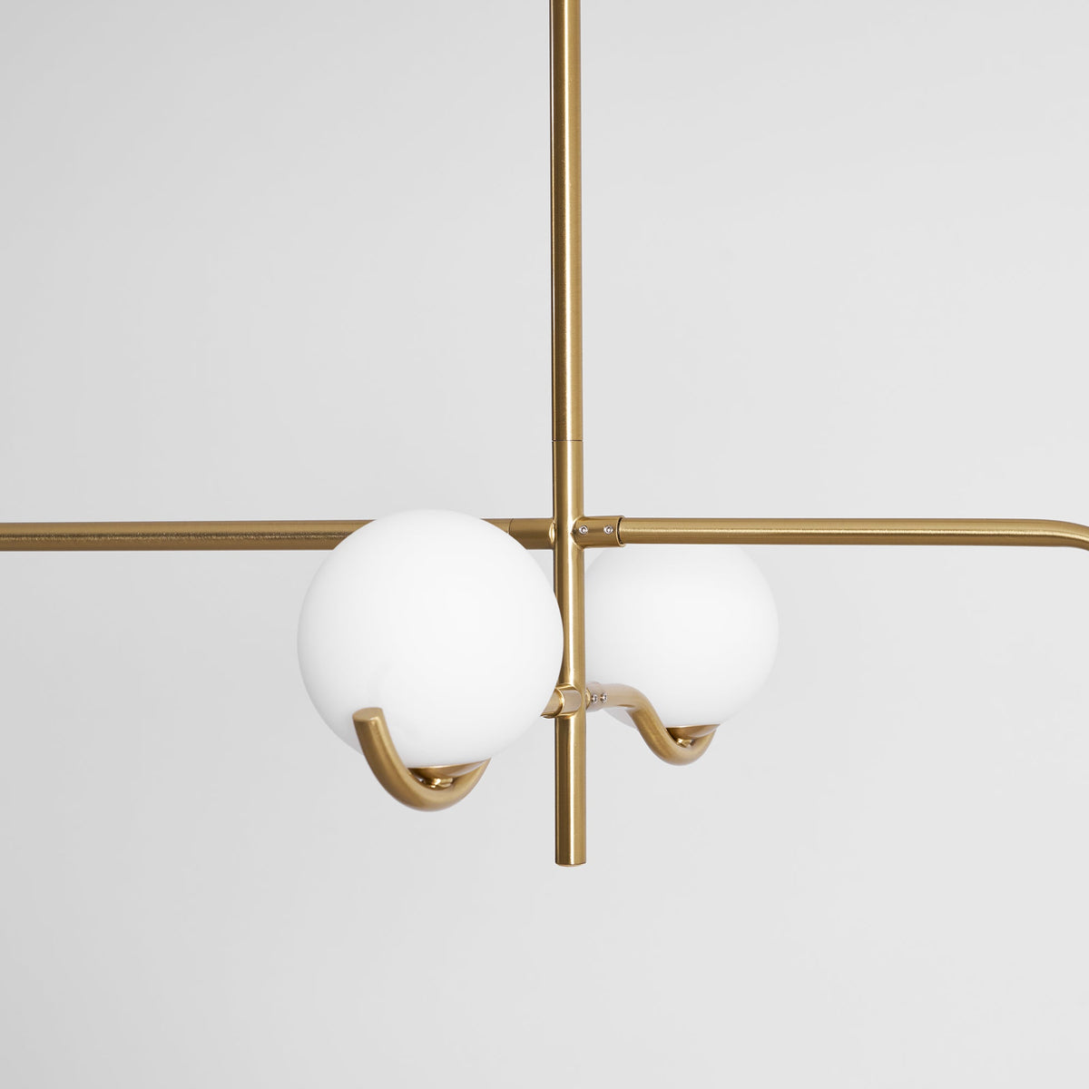 Multi Globe Pendant Light White Glass Shades on Slim Rods Dining Table