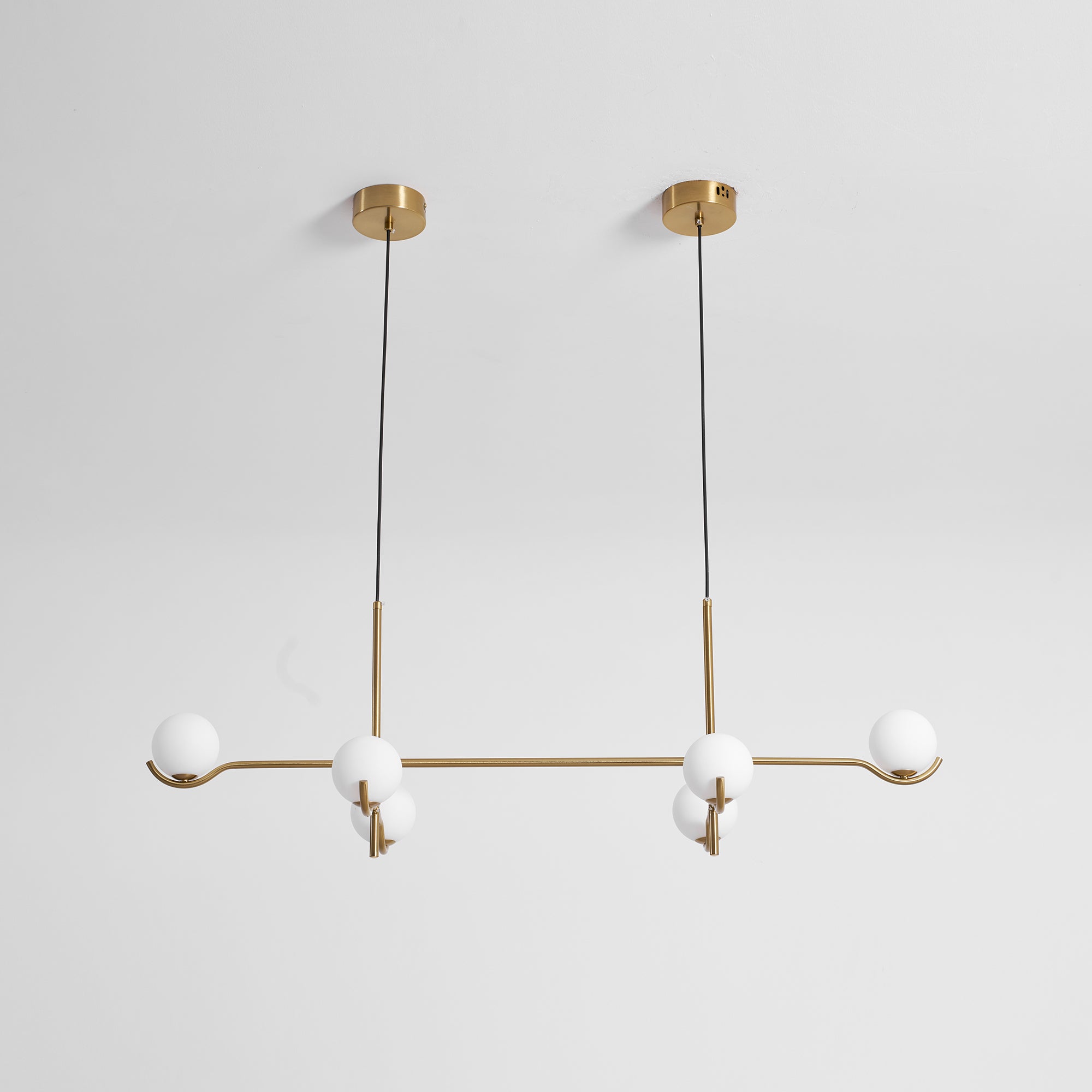 Multi Globe Pendant Light White Glass Shades on Slim Rods Dining Table