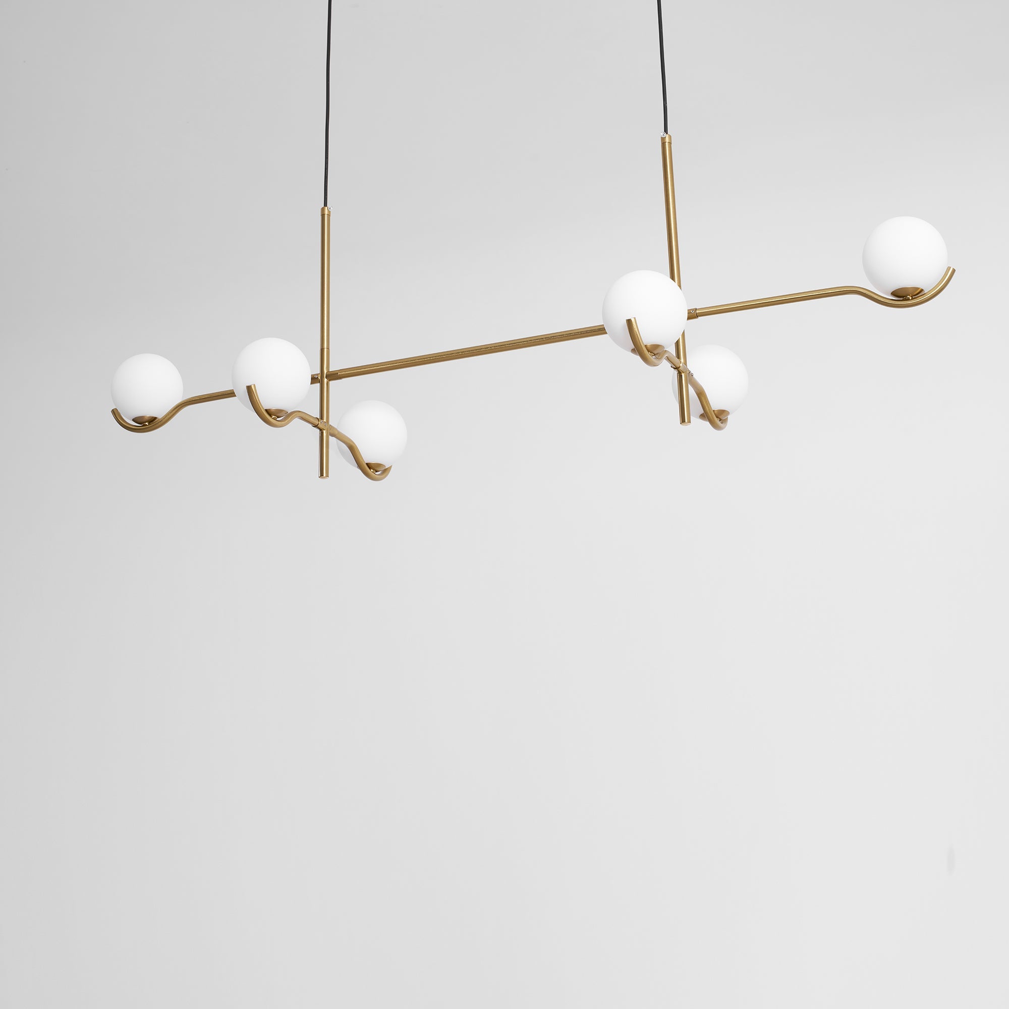 Multi Globe Pendant Light White Glass Shades on Slim Rods Dining Table