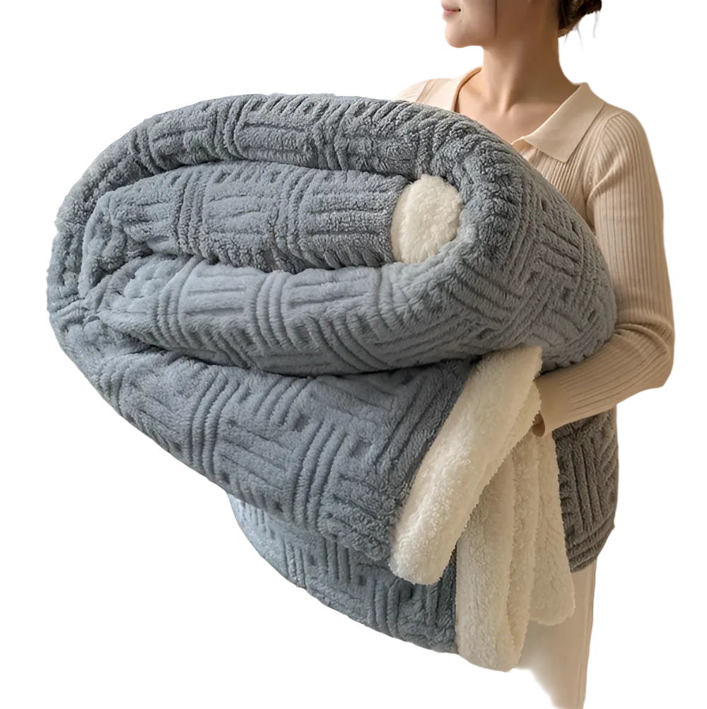 Reversible sofa blanket with embossed pattern and sherpa lining